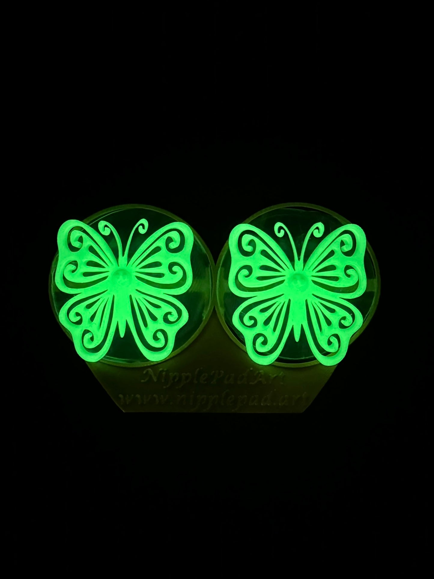 Wiederverwendbare Nippelpads mit Schmetterling-Design - UV-aktiv - Neongrün